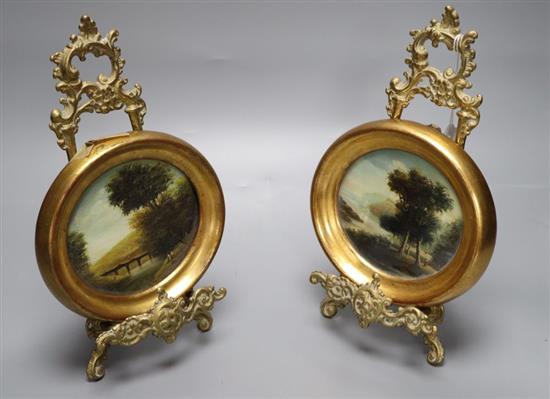 A pair of brass miniature easels and a pair of oils on copper of landscapes, width 15cm